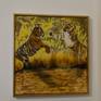 Two tigers fighting with a frame and hanging on a wall