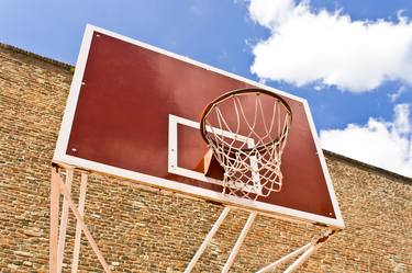Red basketball board over brick wall and blue sky - Limited Edition 1 of 10 thumb