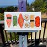 SUSHI AT LARGE on my easel outside