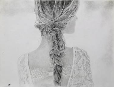 A girl with braided hair thumb