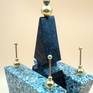 top of space granite structure with brass balls