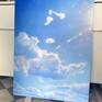 Large drifts of cloud slide across the sky, all the way to the horizon. It's a beautiful hot day, the sky a brilliant blue and hot white clouds come and go. The sun, just off frame, flares across the sky.
Acrylic on canvas wrapped a framed board. A lovely cloud vista to pull your eye into its warmth and space. 860x1140mm, portrait aspect for even a narrow wall, it will bring a warm day into your room. Ready to hang.