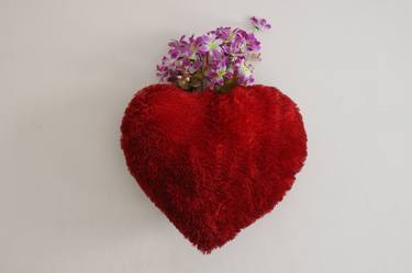 Red Heart Pillow on wall thumb