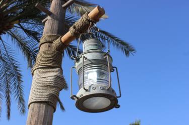 lantern on tree and blue sky thumb