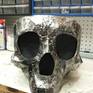 This is a hand-made sheet metal skull bowl crafted from several hundred pieces of 18ga steel. It is clearcoated for the shine and for corrosion resistance.