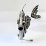 Metal sculpture of a fish.
This sculpture was made from metal, 3D, free standing work of art.