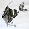 Metal sculpture of a fish.
This sculpture was made from metal, 3D, free standing work of art.