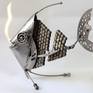 Metal sculpture of a fish.
This sculpture was made from metal, 3D, free standing work of art.