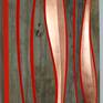 Art pieces utilizing reclaimed wood seem to be reasonably common, however, I wanted to try something different and incorporate some finesse into the finishing and shaping. I stumbled across some cypress at a nearby antique store and after considerable thought came up with this design.

The reclaimed sections juxtapose well with the sculpted copper-leafed sections and the orange edges really accentuate the curves.