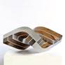 Aluminium 4 mm, wood senna siamea
23 - 28 - 21 cm
2,5 kg
Two different presentations with different expressions are possible - architectural or floating
from the series 'alldimensionale Skulptur'
