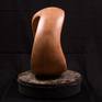This warm, sensuous walnut sculpture comes with a stone stand. Each and every perspective lends a slightly different melody.
