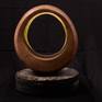 This warm, sensuous walnut sculpture comes with a stone stand. Each and every perspective lends a slightly different melody.