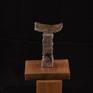 This abstract stone sculpture is of Gneiss and Canadian Strawberry Granite.  It sits on a small wooden stand.