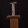 This abstract stone sculpture is of Gneiss and Canadian Strawberry Granite.  It sits on a small wooden stand.