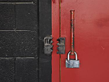 Metal Red painted Door and black concrete wall in Industrial Building. thumb